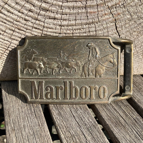 Vintage brass Marlboro belt buckle with cowboys