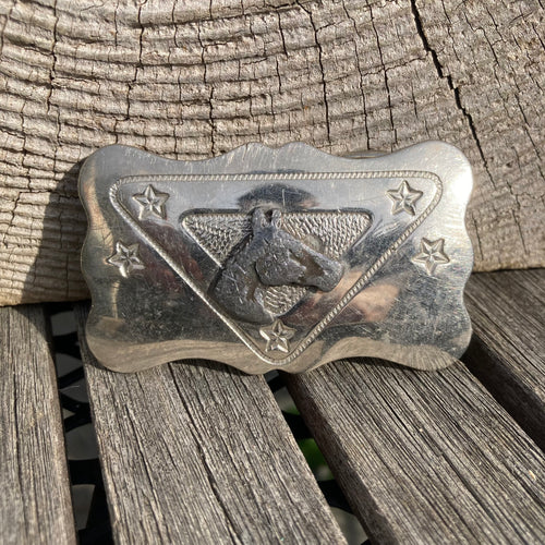 Small vintage western belt buckle featuring a horse head and stars