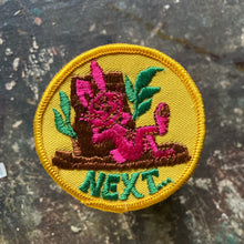 Vintage pink rabbit patch with the word NEXT written below. This suggestive retro patch is for sale on our website!