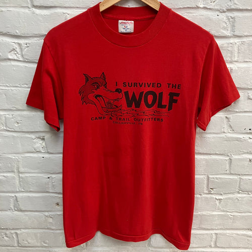 Vintage black screen print on a red tshirt: 