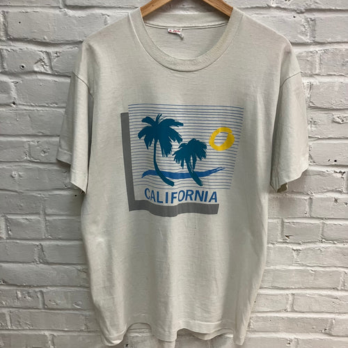Vintage California t-shirt for sale with a retro palm tree and sunset graphic screen print