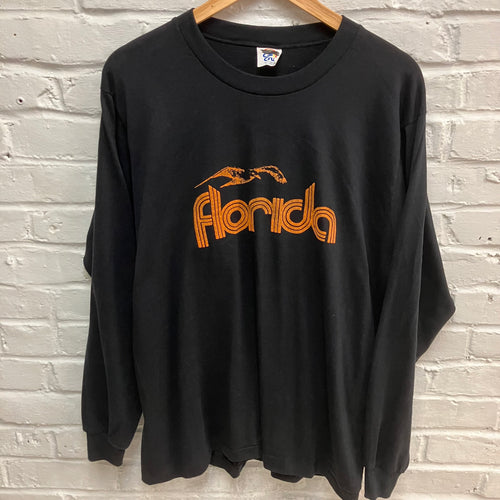 Vintage black long-sleeve shirt with 'Florida' printed in orange with a seagull design for sale.