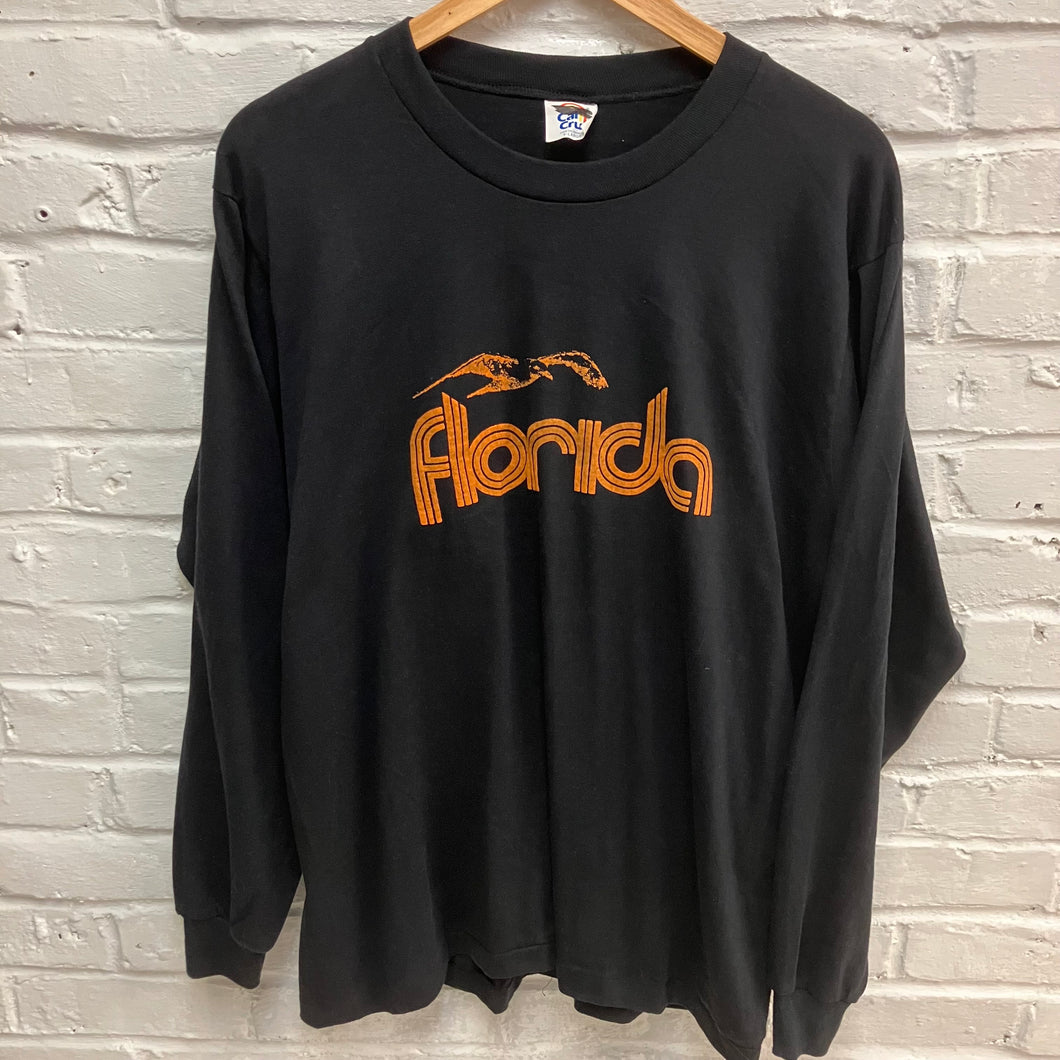 Vintage black long-sleeve shirt with 'Florida' printed in orange with a seagull design for sale.