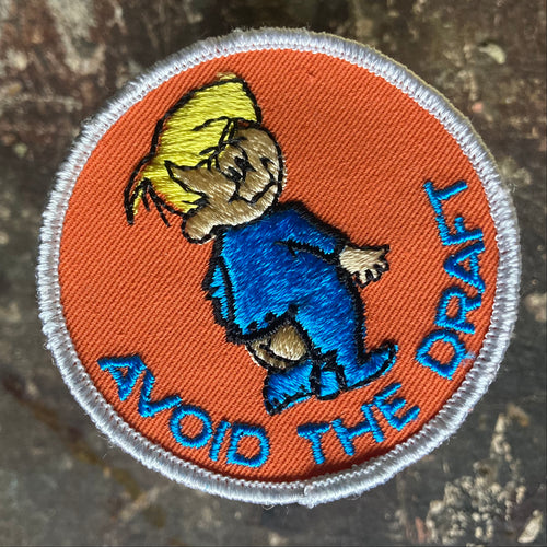 For sale is a Vintage Avoid the Draft embroidered patch, featuring a baby in a onesies that needs to be buttoned. 