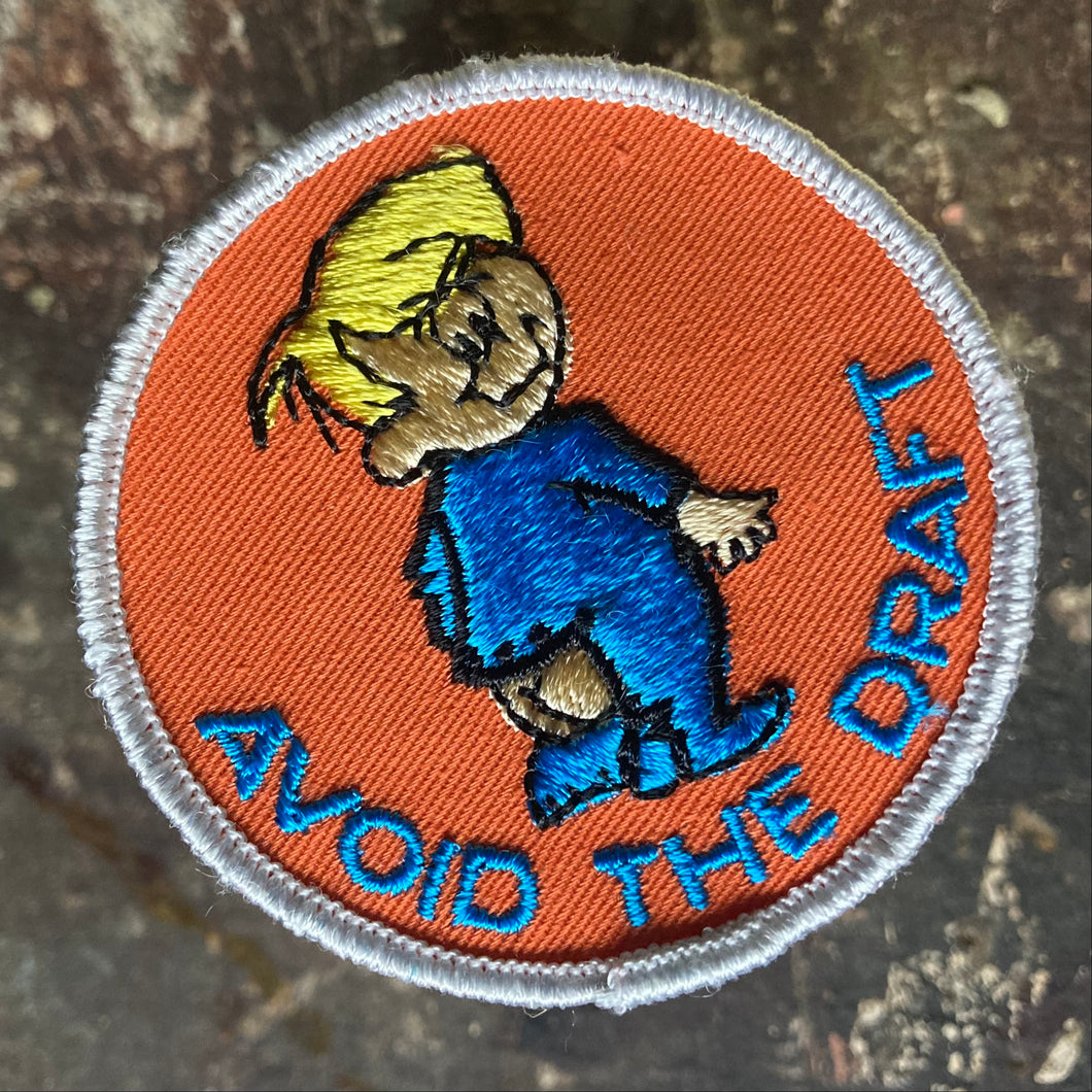 For sale is a Vintage Avoid the Draft embroidered patch, featuring a baby in a onesies that needs to be buttoned. 