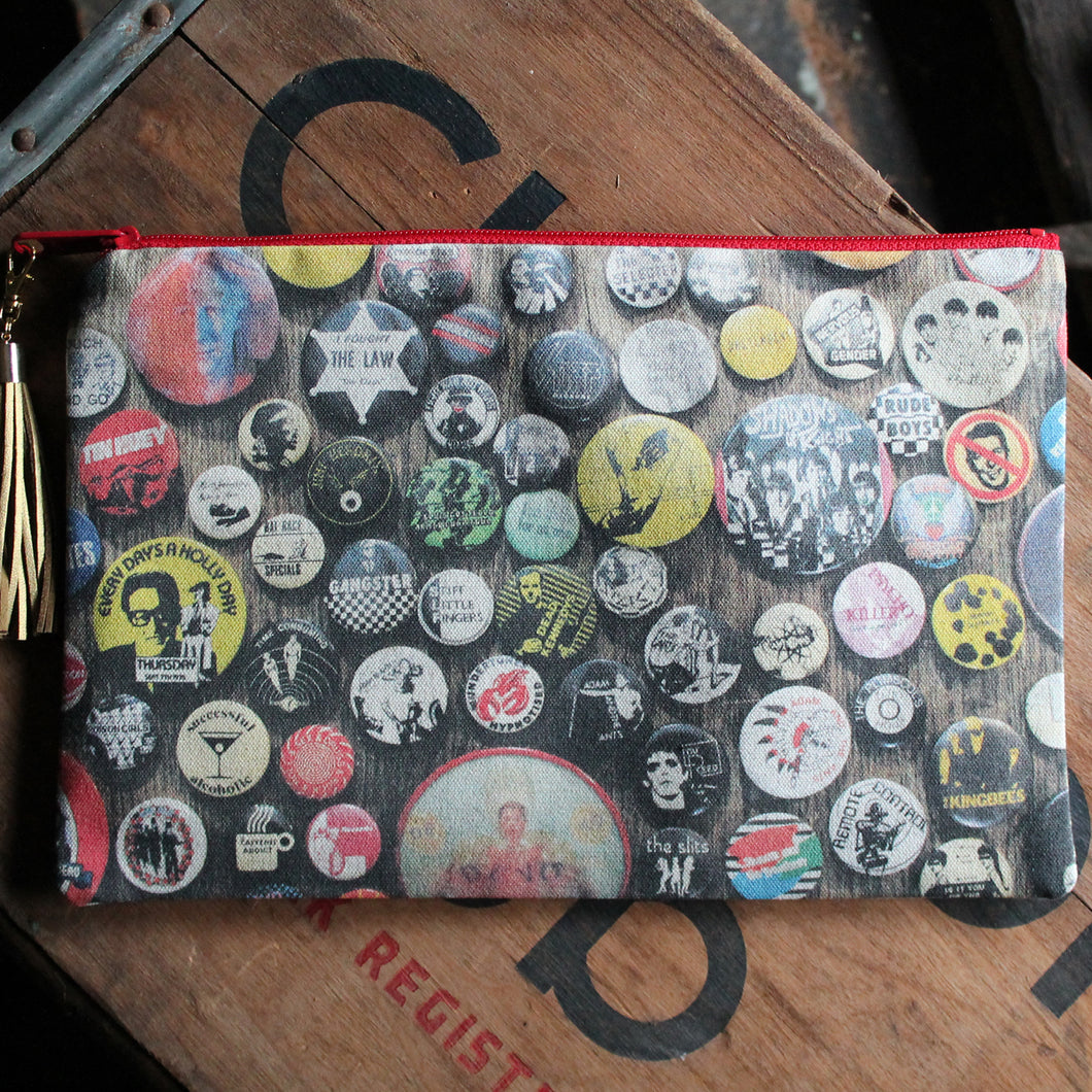 Punk Rock pinback button fashion bag for sale with Buzzcocks, Devo, Lou Reed and other rock and roll bands featured art.