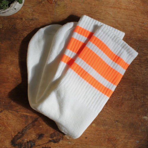 Neon Orange tube socks for sale retro skateboarding style fashion with stripes
