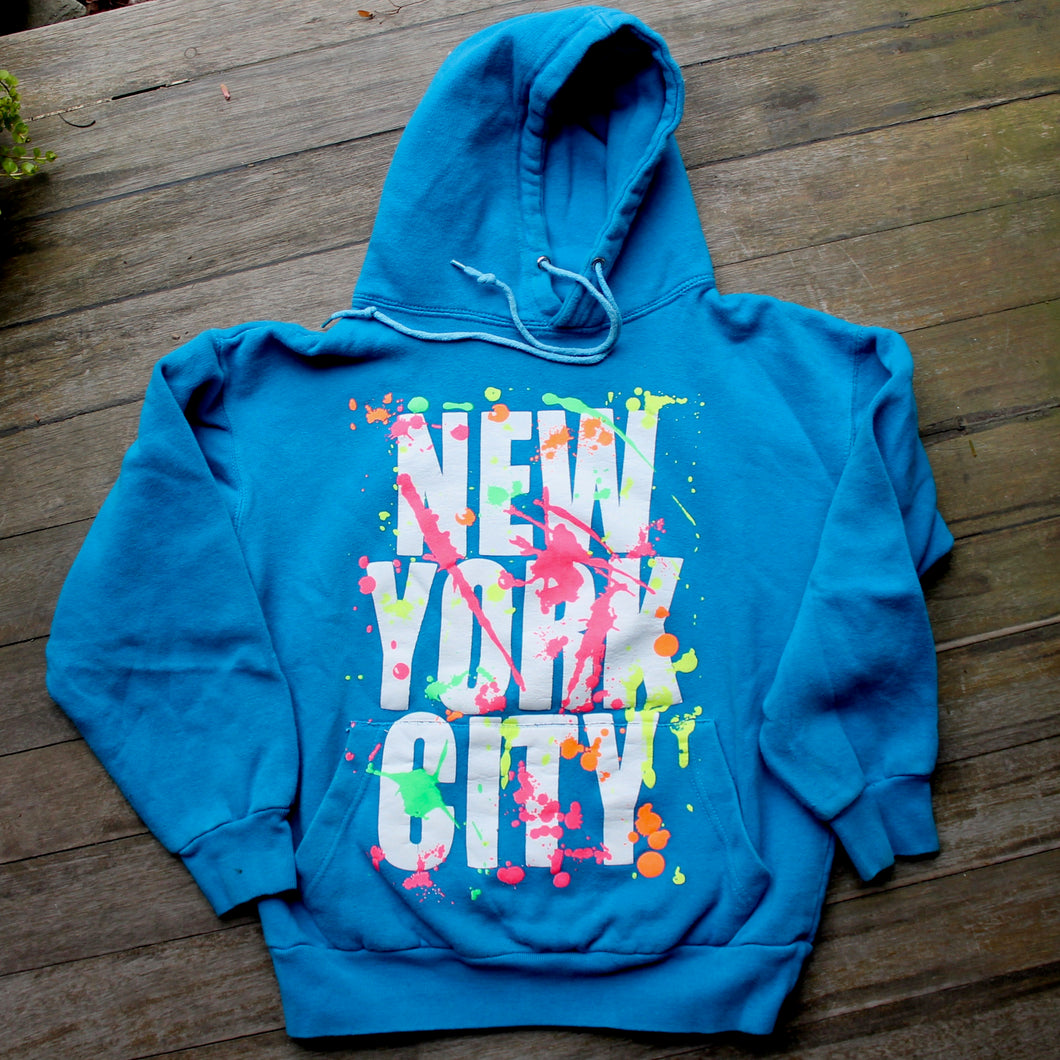 Thrift store New York City hooded sweatshirt with neon splatter design 1980s
